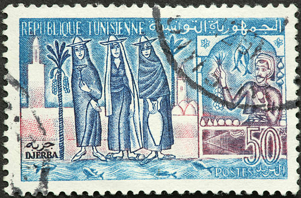 istock Tunisian women shopping on an old postage stamp 184960792