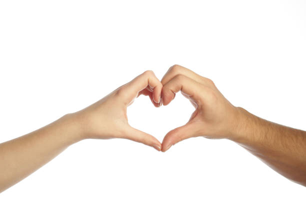 Man and woman hands forming a heart stock photo