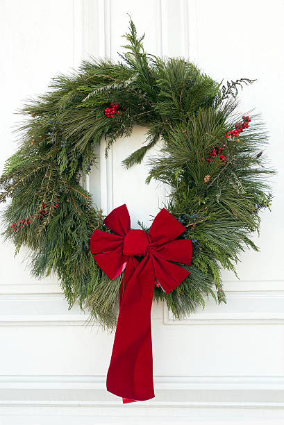 istock Christmas Wreath on a White Door 184961152