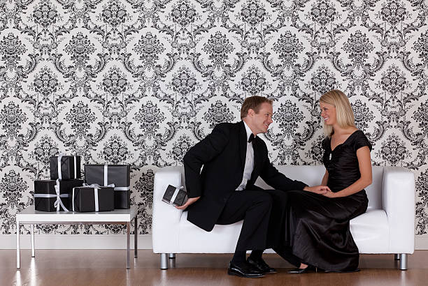 istock Man hiding a gift from his wife 184961624