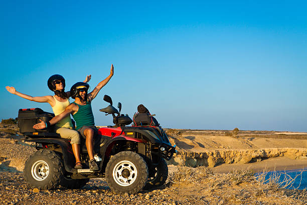 istock happy couple on atv 184961937