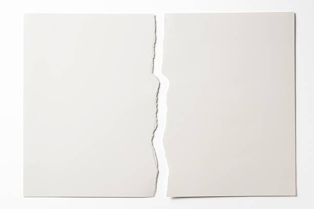 Isolated shot of torn white paper on white background Close-up of blank torn piece of white paper isolated on white background with clipping path. split pictures stock pictures, royalty-free photos & images