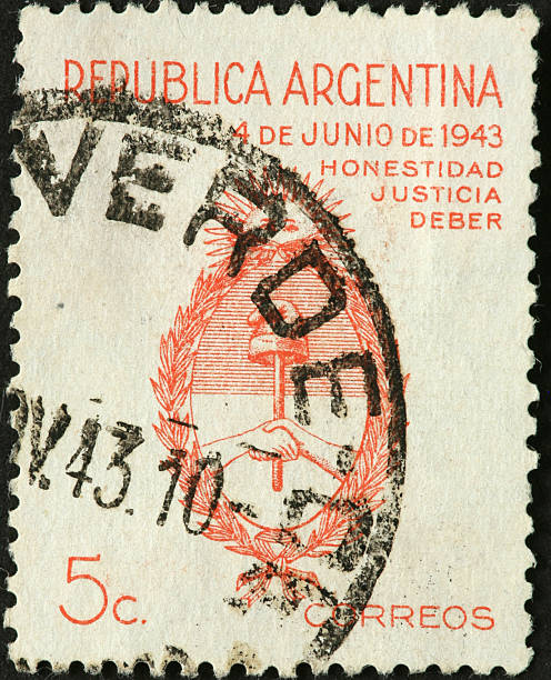 istock hands shaking on old Argentine postage stamp 184962160
