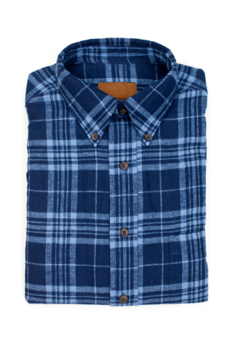 New folded man's flannel shirt, isolated on white.