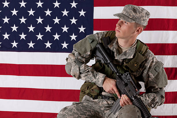 istock Army soldier in front of an American flag 184962842