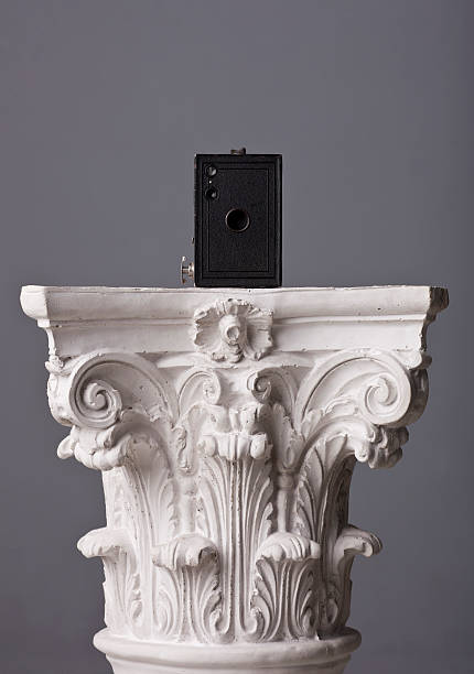istock old box camera on a corinthian capital 184963476
