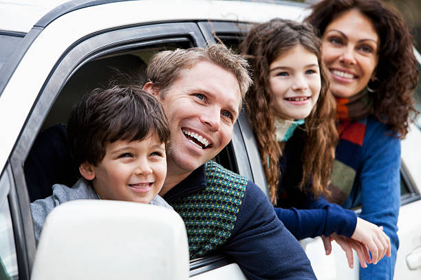 istock Family with two children in car 184963596