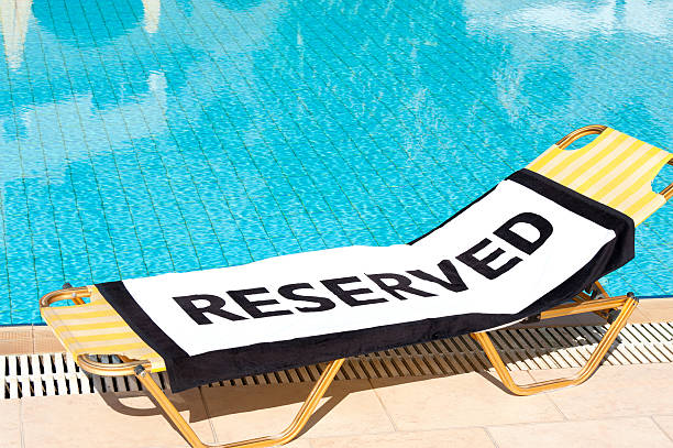 'Reserved' beach towel on a sun lounger