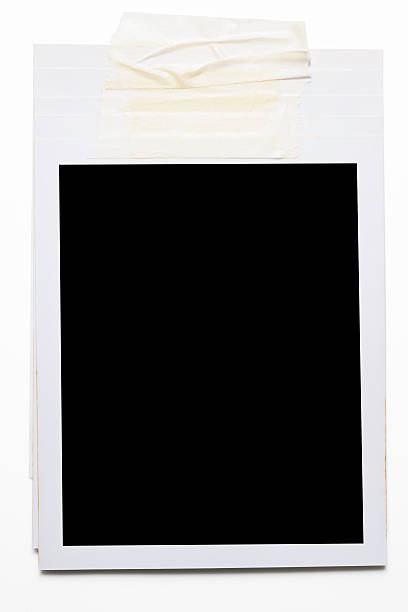 istock Stacked blank Polaroid with adhesive tape on white background 184963810