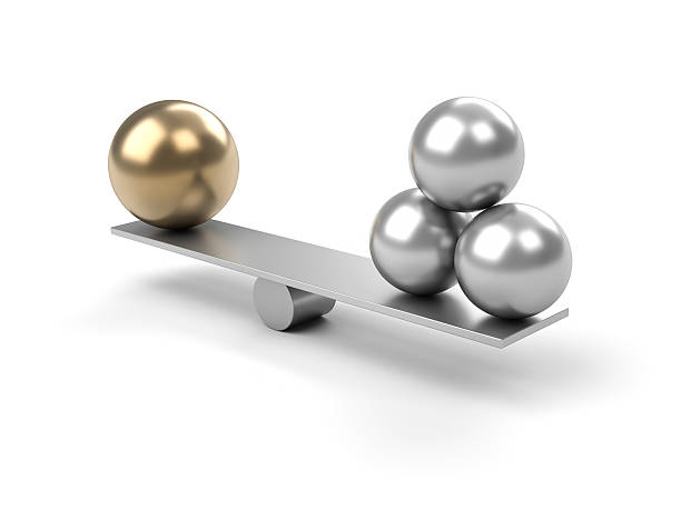 Metal balance with large ball on one side and 3 small balls Seesaw with Spheres, 3D rendering metal sphere stock pictures, royalty-free photos & images