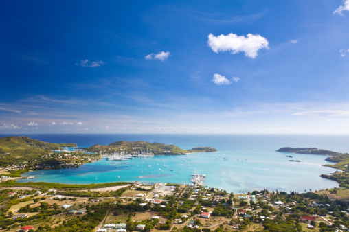 View of a Caribbean bay in the British Virgin Islands with boats surrounded by islands on a sunny day