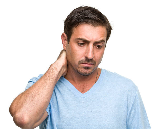 Stressed Man Rubs Neck Portrait of a man on a white background. http://s3.amazonaws.com/drbimages/m/as.jpg man regret stock pictures, royalty-free photos & images