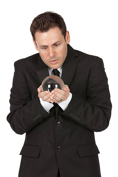 istock Businessman holding a crystal ball 184964903
