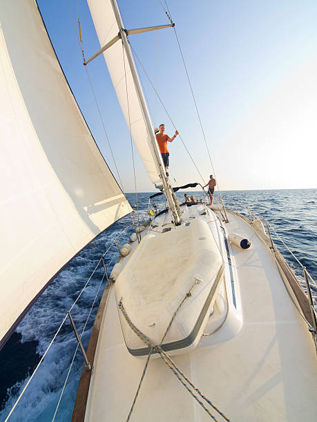 istock Middle aged men enjoying sailing on boat in Croatia 184965093