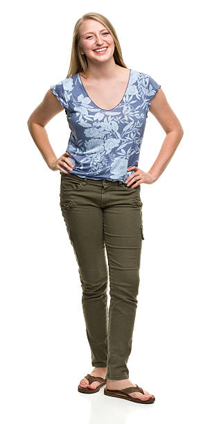istock Smiling Young Woman Standing With Arms Akimbo 184965109