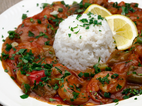 Classic cajun preparation of stewed peppers, onions and tomatoes with piquant spices with a side of white rice. This one prepared with shrimp.