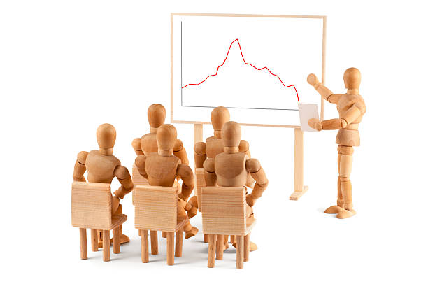 istock Wooden Mannequin and business graph 184965737