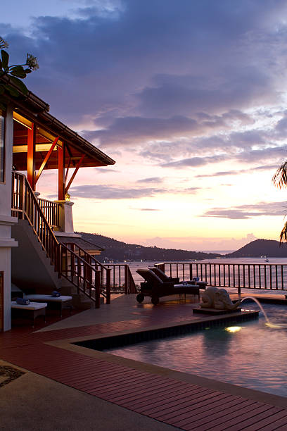 istock Sunset at a luxurious swimming pool tropical villa 184966218