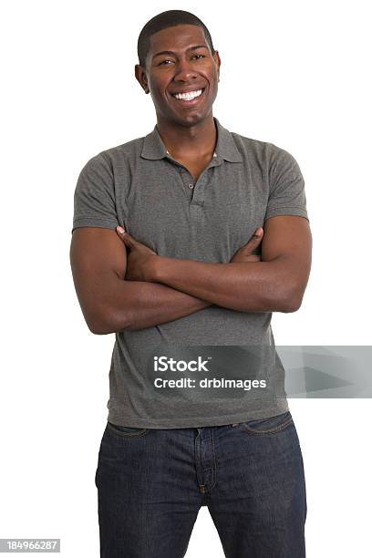 Foto de Jovem Sorridente Em Pé e mais fotos de stock de Camisa Pólo - Camisa Pólo, Homens, Azul escuro