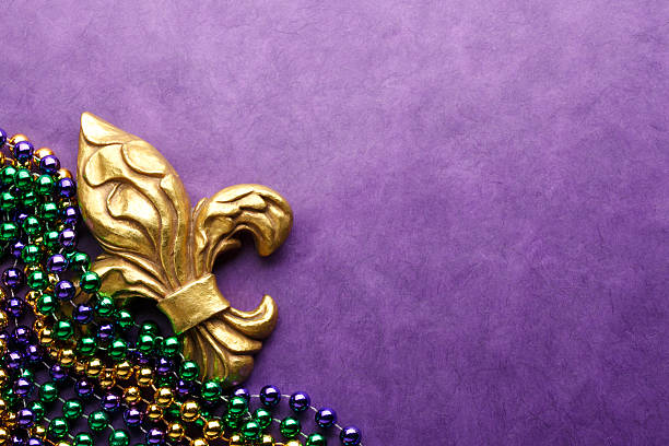 Fleur De Lys & Mardi Gras Beads A Fleur-De-Lys and Mardi Gras beads. new orleans mardi gras stock pictures, royalty-free photos & images