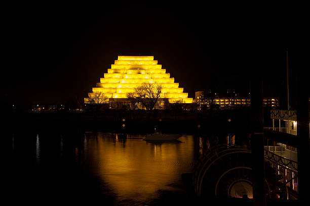 View across Sacramento River at West Sacramento Ziggurat building at night.