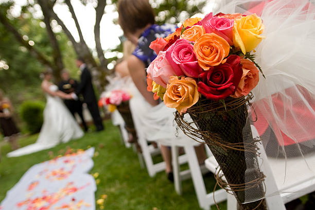 istock Multi colored Wedding Bouquet at ceremony with couple 184967416