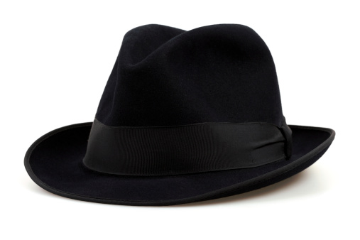 Black textile hat for women isolated on white background. Elegant fashinable headwear