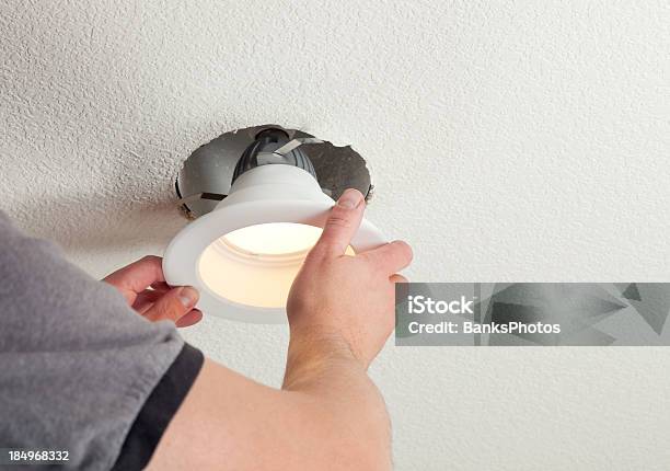Installing Led Retrofit Bulb Into Ceiling Fixture Stock Photo - Download Image Now - Lighting Equipment, Illuminated, Installing