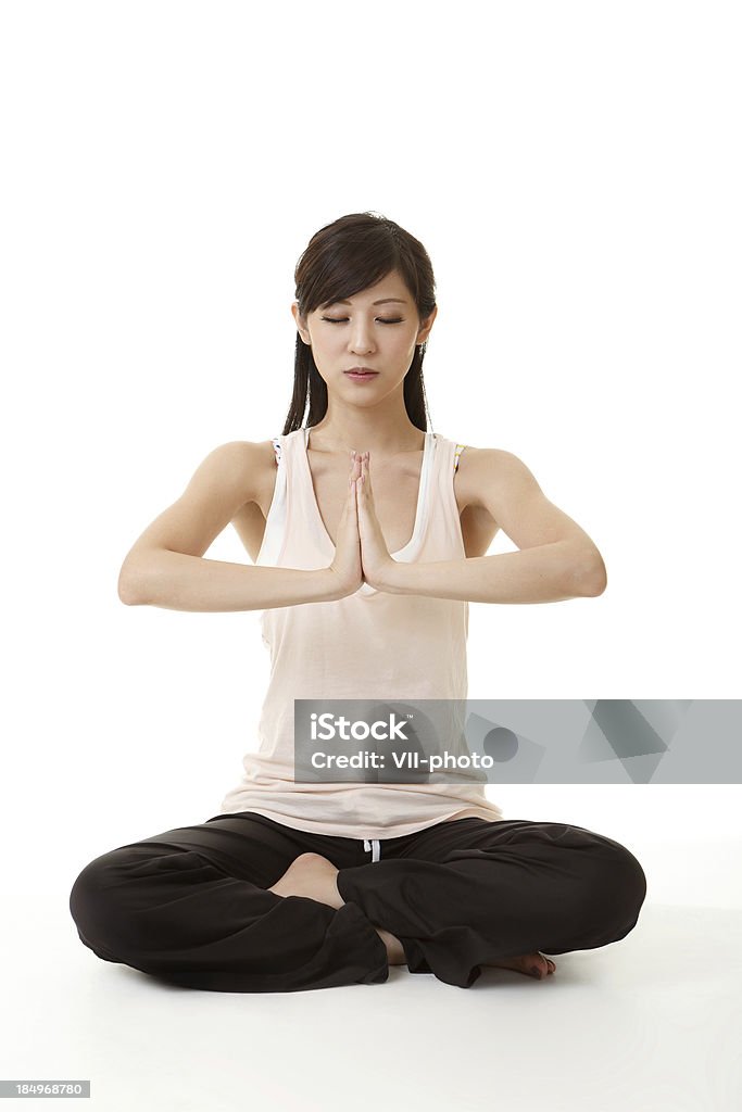 yoga Portrait of beautiful young woman doing yoga exercise. Activity Stock Photo