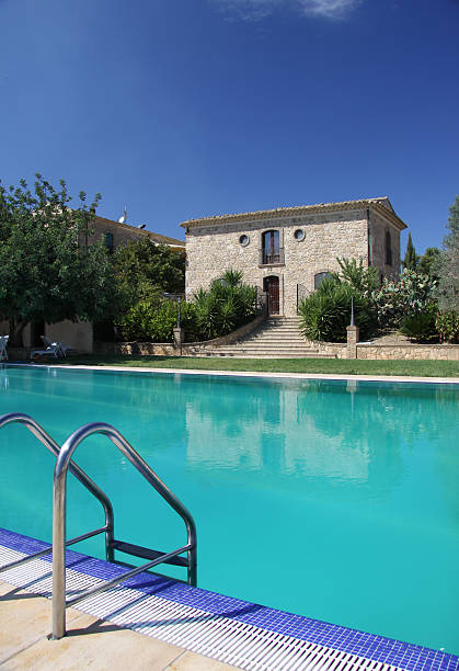 istock serene pool with blue colors and sky 184968884