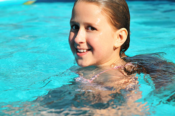 istock girl in swimming pool 184968901