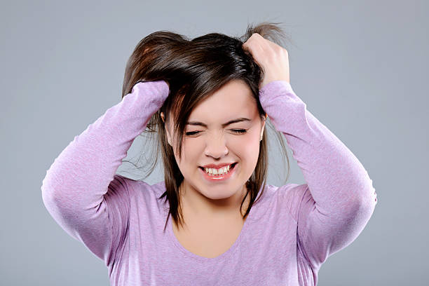istock girl with headache 184969000