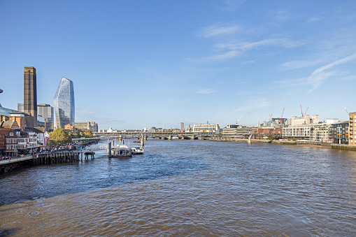 Southwark Bridge, London, England - October 28th 2023:  View to One Blackfriars which is a modern skyscarper and the tower of Tate Modern Museum