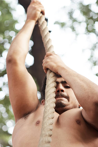 istock Indian wrestler on climbing rope 184969223