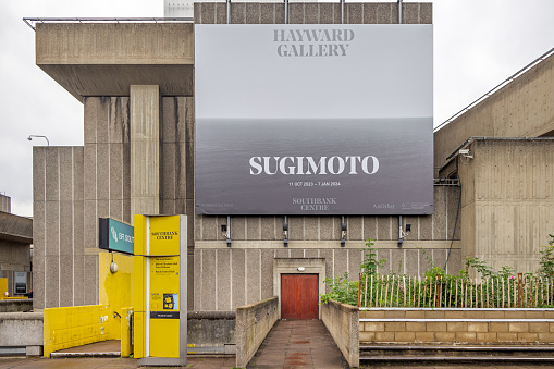 South bank of river Thames, London, England - October 27th 2023:  Poster for an exhibition with the photographer Sugimoto outside the famous gallery in the concrete New Brutalist building from 1968