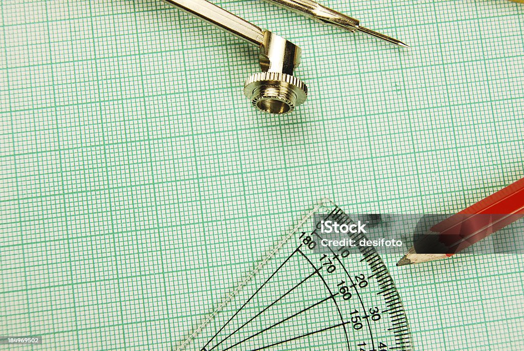 Protractor and a pencil on graph paper Angle Stock Photo