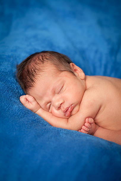 istock Color Image of Baby Boy Sleeping Peacefully, On Blue Blanket 184969563