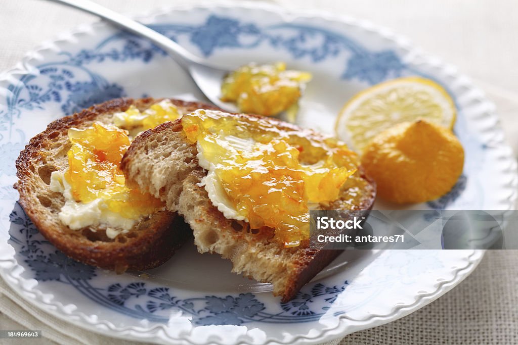 Bread with marmalade Morning toasts with butter and citrus marmalade Preserves Stock Photo