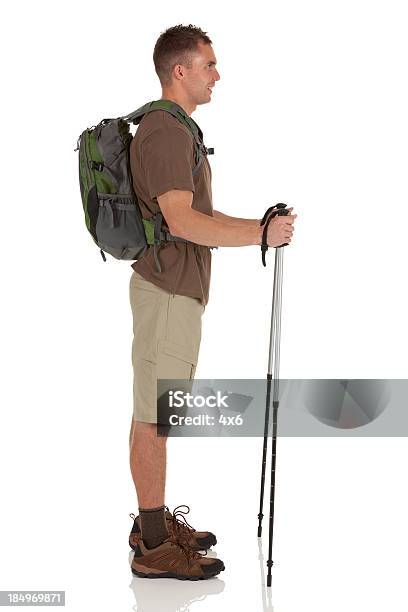 Profile Of Hiker With Hiking Pole Stock Photo - Download Image Now - 20-29 Years, Adult, Adults Only