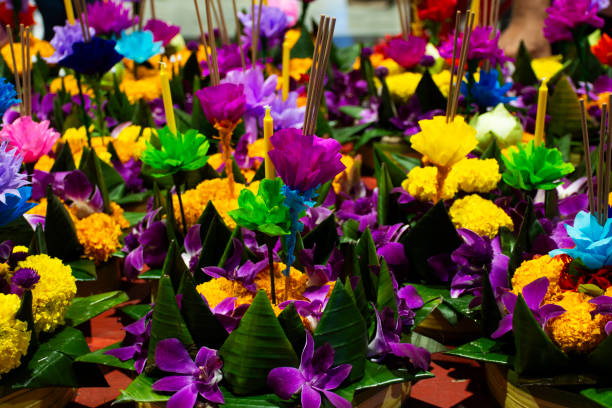 istock Colorful handmade krathong or floating lantern basket sale thai people into float ritual vessel at river for forgiveness from Khongkha Goddess of water in Loy Krathong festival in Nonthaburi, Thailand 1849703542