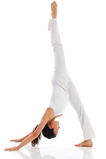istock Young woman exercising yoga 184970577