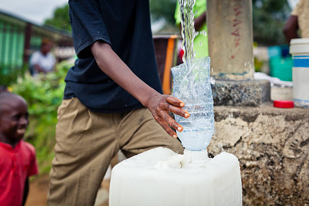 istock African Boy By Water Pump 184970695