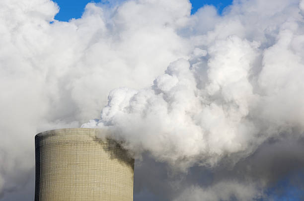 istock Cooling tower of a power station with pollution 184970793
