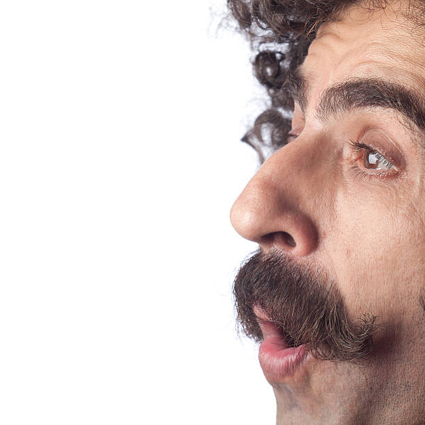 istock Side view of man with mustache shocked on white background 184971496