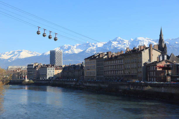 Grenoble "City of Grenoble, France. River Isere is in the foreground. Beldonne mountains are in the background." isere river stock pictures, royalty-free photos & images