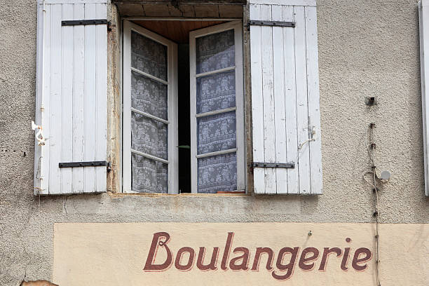 istock wooden shutters above an old French bakery 184971937