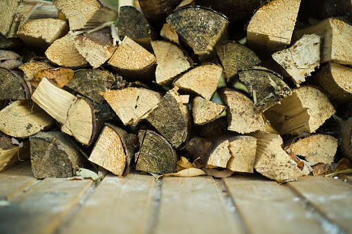 a pile of logs split and dried,