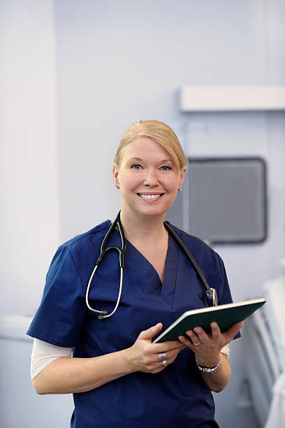istock Smiling female doctor with a tablet. 184972093