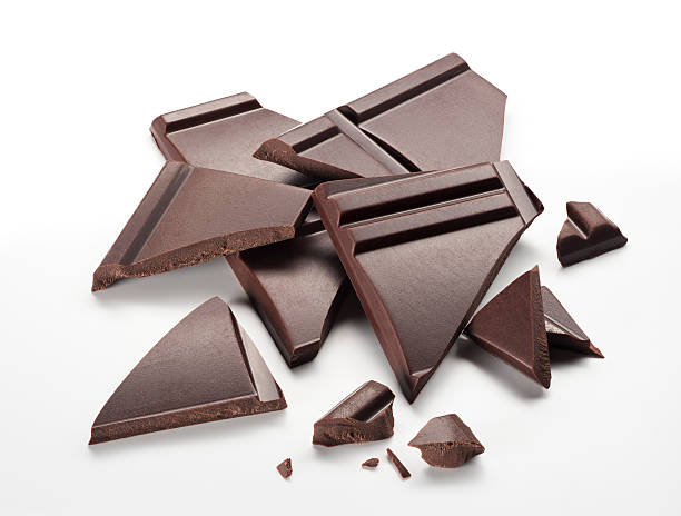 High Angle View Of Chocolate Bar On Wax Paper