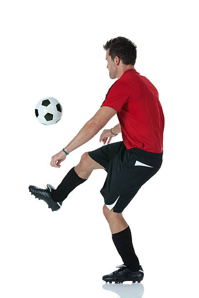 istock Man playing with a soccer ball 184972713